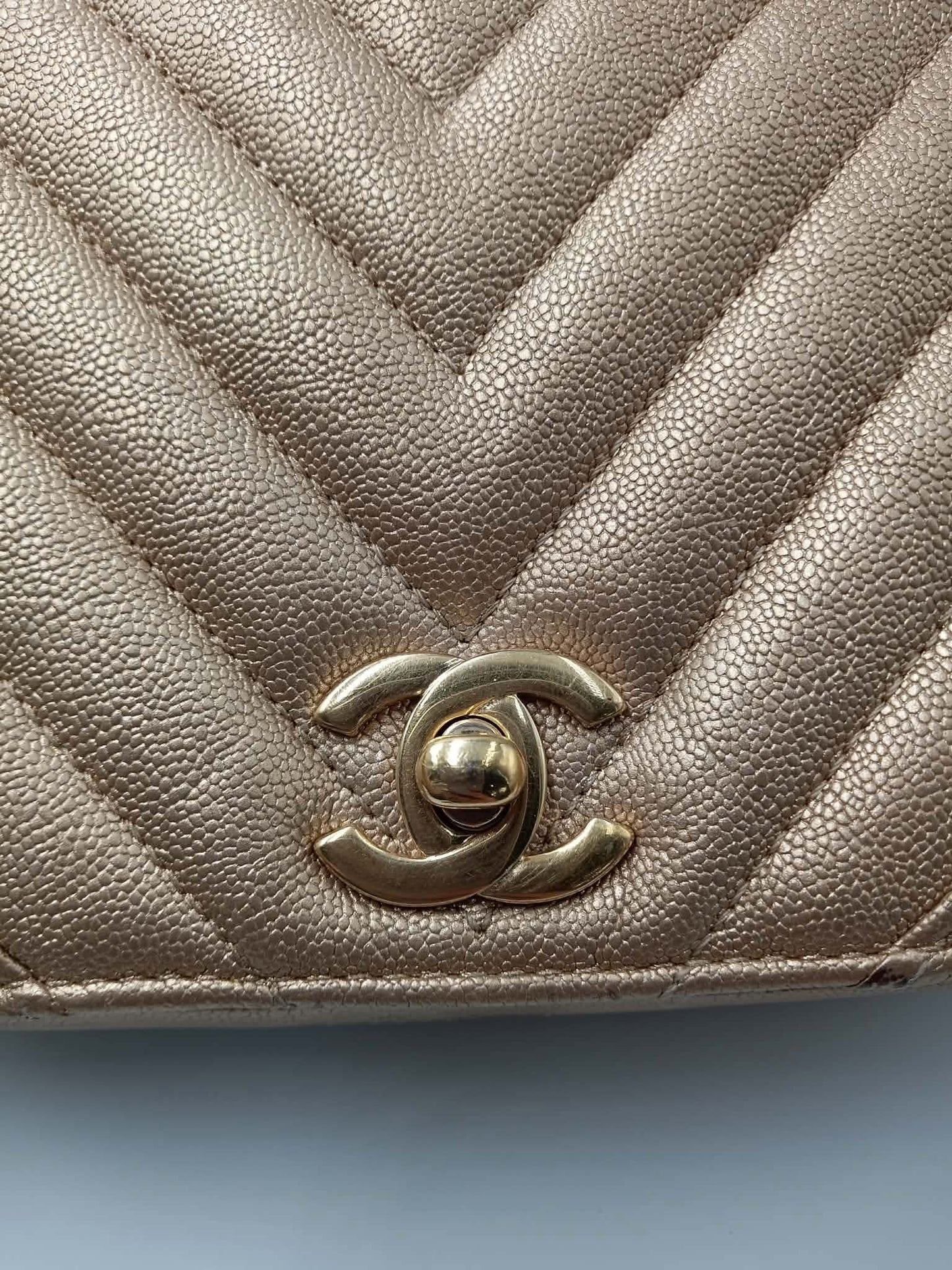 CHANEL Caviar Chevron Mini Statement Metallic Flap